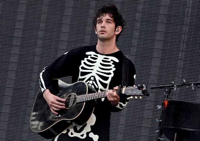 Lisa Lake/TAS23/Getty Images Matty Healy performing during Phoebe Bridgers' opening set at the Eras Tour.