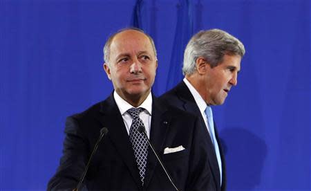 U.S. Secretary of State John Kerry (R) joins French Foreign Minister Laurent Fabius at a news conference after a meeting regarding Syria, at the Quai d'Orsay in Paris September 16, 2013. REUTERS/Larry Downing