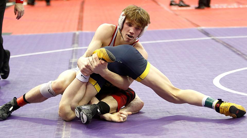 Crestview's Hayden Kuhn wrestles Kirtland's Will Davidson during their match Friday, March 11, 2022 at the OHSAA State Wrestling Championship at the Jerome Schottenstein Center in Columbus. TOM E. PUSKAR/TIMES-GAZETTE.COM