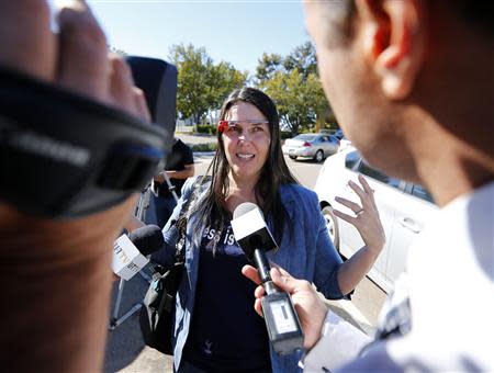 Defendant Cecilia Abadie speaks to the media as she arrives at a traffic court in San Diego January 16, 2014. REUTERS/Mike Blake