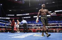 <p>Floyd Mayweather Jr. and Conor McGregor walk back to their corners at the end of a round REUTERS/Steve Marcus </p>