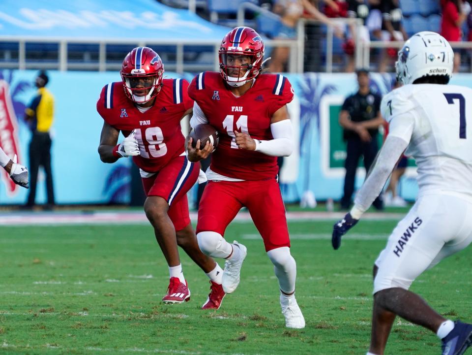 Florida Atlantic quarterback Casey Thompson (11) rushes for a first down in the first quarter against Monmouth at FAU Stadium on Saturday, September 2, 2023, in Boca Raton, FL.