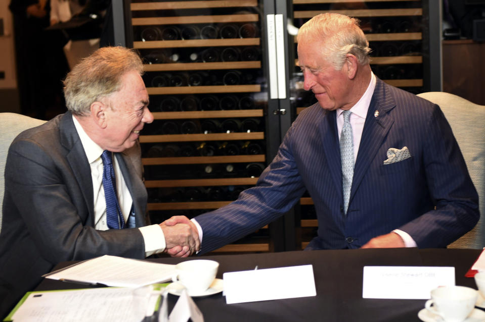 FILE - Britain's Prince Charles meets Andrew Lloyd Webber during a visit to the Royal Albert Hall to discuss the arts and creativity in school, in London, Wednesday, Sept. 5, 2018. Andrew Lloyd Webber, the English composer who created the scores for blockbuster musicals such as “Cats,’’ “The Phantom of the Opera’’ and “Evita,’’ has written the anthem for King Charles III’s coronation, adapting a piece of church music that encourages singers to make a “joyful noise.” (Eddie Mulholland/Pool Photo via AP, File)