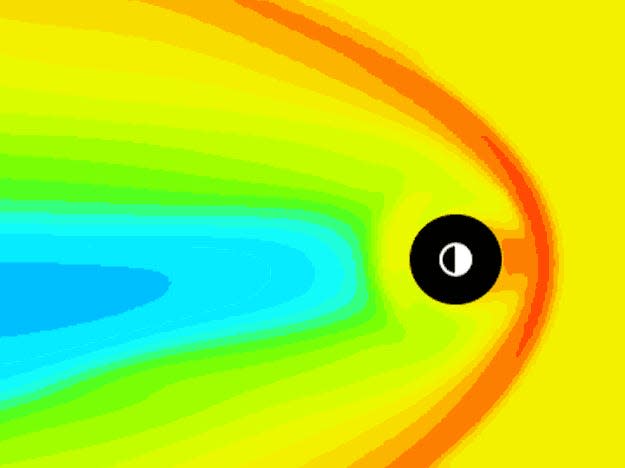 An animation shows the Earth as a black ball, and the intensity of solar radiation is shown in gradients of orange to blue around the Earth. The animation shows that radiation is deflected around the Earth.