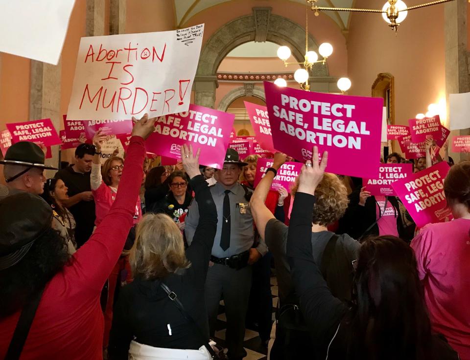 Opponents and supporters of the "heartbeat bill" rally outside the Ohio House of Representatives chamber on April, 10.