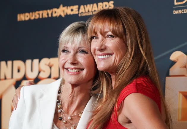 Olivia Newton-John and Jane Seymour pose for photos together at an event in 2019. 