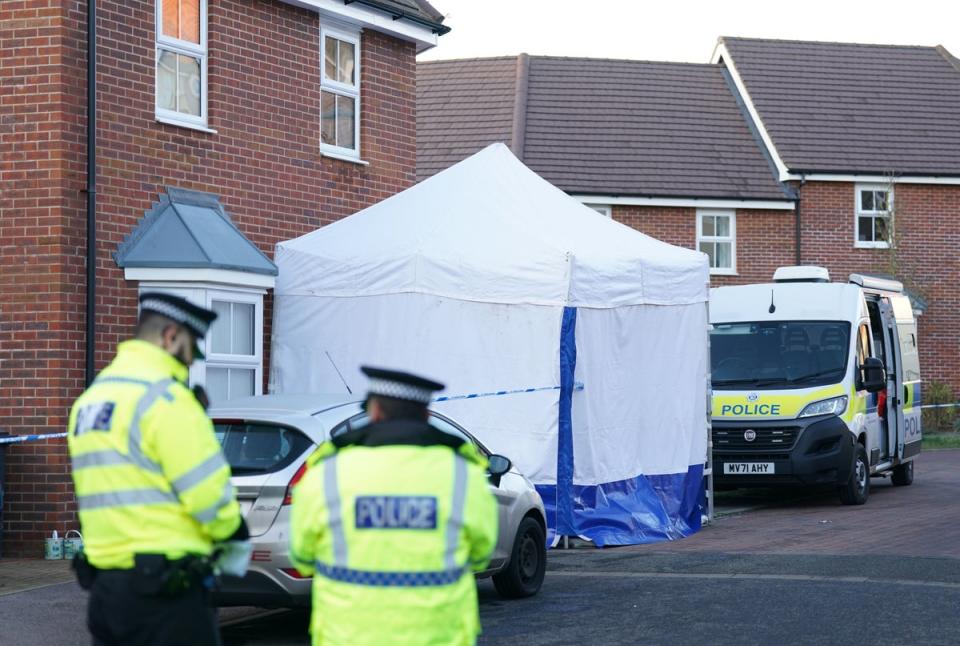 A police cordon is in place at the estate (PA)