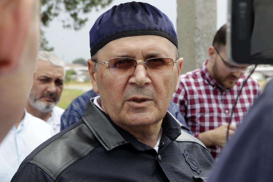 Oyub Titiev, the head of a Chechnya branch of the prominent human rights group Memorial speaks to his supporters as he leaves a prison in Argun, Russia, Friday, June 21, 2019. Titiyev was released from a Russian prison on Friday morning, more than 18 months after first being detained on drug charges his supporters say were fabricated. (AP Photo/Musa Sadulayev)