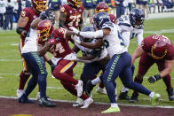 Washington Football Team running back Peyton Barber (34) runs past the Seattle Seahawks defense to score a touchdown during the second half of an NFL football game, Sunday, Dec. 20, 2020, in Landover, Md. (AP Photo/Susan Walsh)