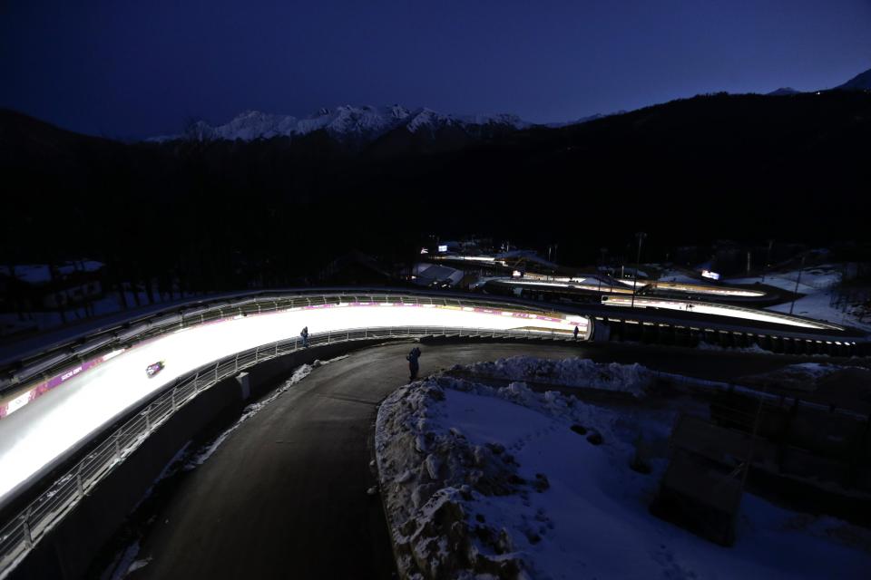 David Moeller of Germany takes a turn during a training session for the men's singles luge at the 2014 Winter Olympics, Friday, Feb. 7, 2014, in Krasnaya Polyana, Russia. (AP Photo/Natacha Pisarenko)