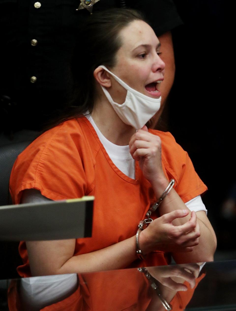 Erica Stefanko pulls down her mask and mouths the words "I love you" to her mother after she was sentenced to life in prison in July 2021. Stefanko's conviction was later overturned and she will be retried starting Tuesday.