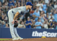 Los Angeles Dodgers pitcher Michael Grove reacts as Toronto Blue Jays' Alejandro Kirk rounds the bases on a solo home run during second-inning baseball game action in Toronto, Sunday, April 28, 2024. (Frank Gunn/The Canadian Press via AP)