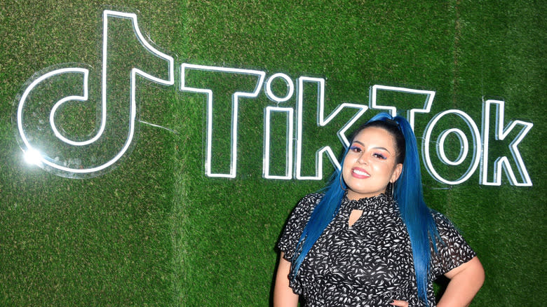 Alejandra Tapia with TikTok sign