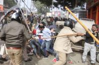 In this photo taken on December 19, 2019 police beat protesters with sticks during a demonstration against India's new citizenship law in Lucknow. - Indians defied bans on assembly on December 19 in cities nationwide as anger swells against a citizenship law seen as discriminatory against Muslims, following days of protests, clashes and riots that have left six dead. (Photo by STR / AFP) (Photo by STR/AFP via Getty Images)