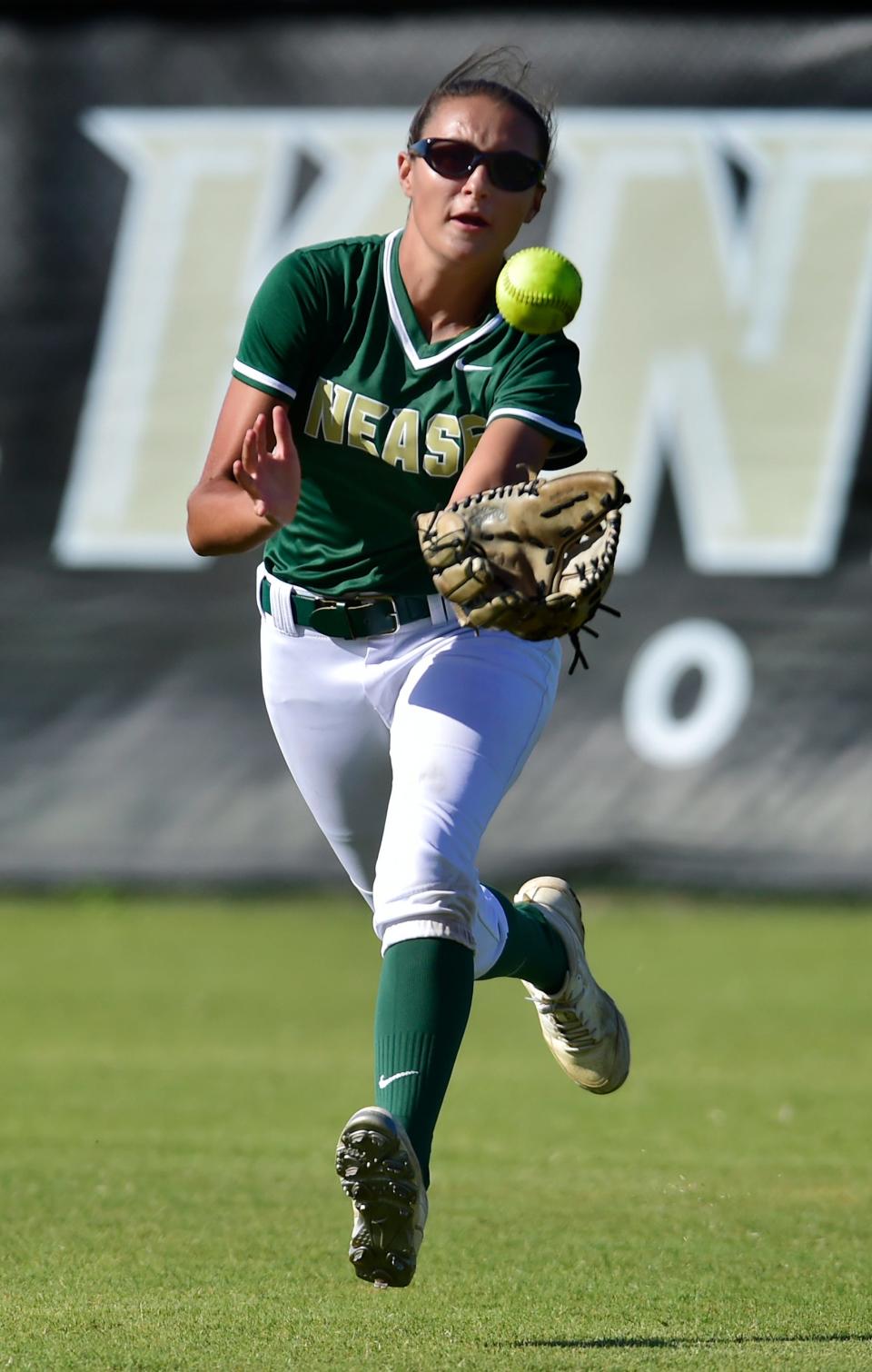 Nease's Miranda Harmon runs to catch the ball in warmups before a district tournament game against First Coast.