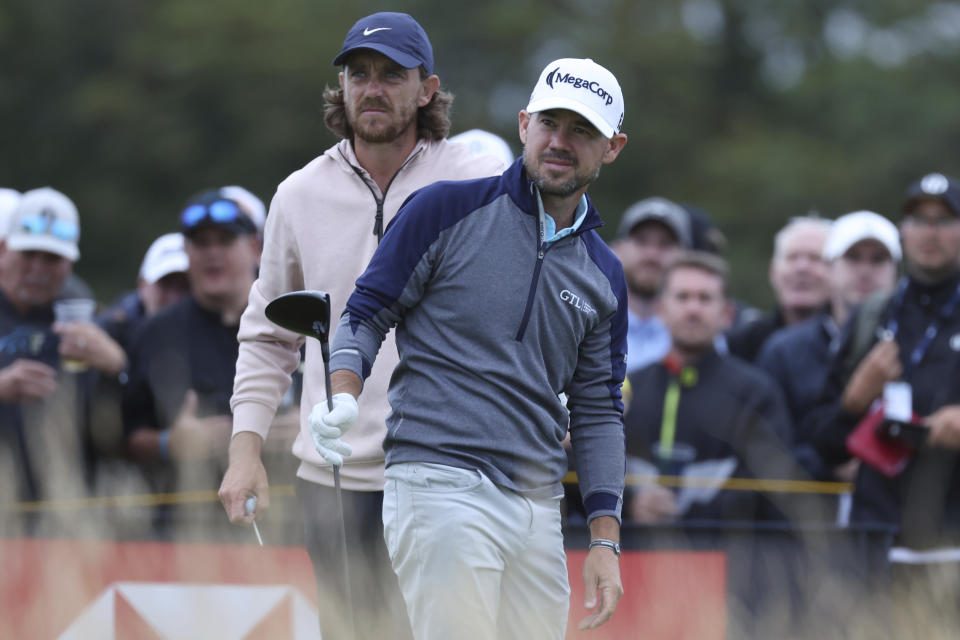 United States' Brian Harman, right and England's Tommy Fleetwood look down the 14th hole from the tee during the third day of the British Open Golf Championships at the Royal Liverpool Golf Club in Hoylake, England, Saturday, July 22, 2023. (AP Photo/Peter Morrison)
