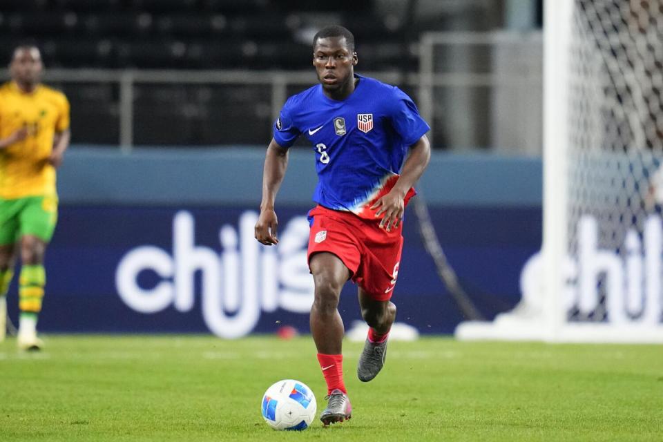 United States' Yunus Musah runs with the ball d