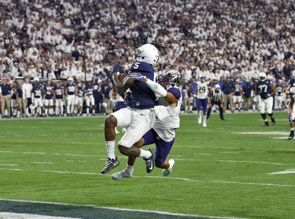 Penn State wide receiver DaeSean Hamilton (5) pulls in a touchdown catch as Washington defensive back Myles Bryant defends during the second half of the Fiesta Bowl NCAA college football game, Saturday, Dec. 30, 2017, in Glendale, Ariz. (AP Photo/Ross D. Franklin)