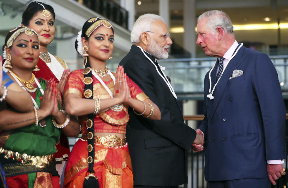 FILE - Britain's Prince Charles, right, and India's Prime Minister Narendra Modi visit the Science Museum in London, April 18, 2018. India, once the largest of Britain’s colonies that endured two centuries of imperial rule has moved on. Queen Elizabeth II’s death provoked sympathies from some while for a few others, it jogged memories of a bloody history under the British crown. Among most regular Indians, the news was met with an indifferent shrug. (Hannah McKay/Pool Photo via AP, File)