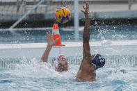 U.S. Olympic Water Polo Team attacker Max Irving, right, trains with attacker Alex Bowen for the Paris Olympics, at Mt. San Antonio College in Walnut, Calif., on Wednesday, Jan. 17, 2024. Irving's father, Michael Irving, is a Pac-12 college basketball referee. Max Irving is also the only Black man on the U.S. Olympic Water Polo Team and a prominent advocate for diversity in the sport. (AP Photo/Damian Dovarganes)