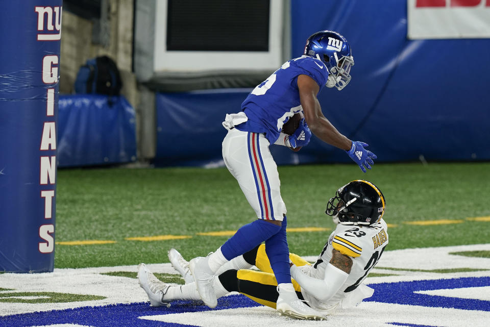 New York Giants wide receiver Darius Slayton (86) comes up after catching a touchdown pass against Pittsburgh Steelers cornerback Joe Haden (23) during the first quarter of an NFL football game Monday, Sept. 14, 2020, in East Rutherford, N.J. (AP Photo/Seth Wenig)