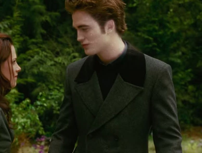 Edward wearing a long jacket and pants