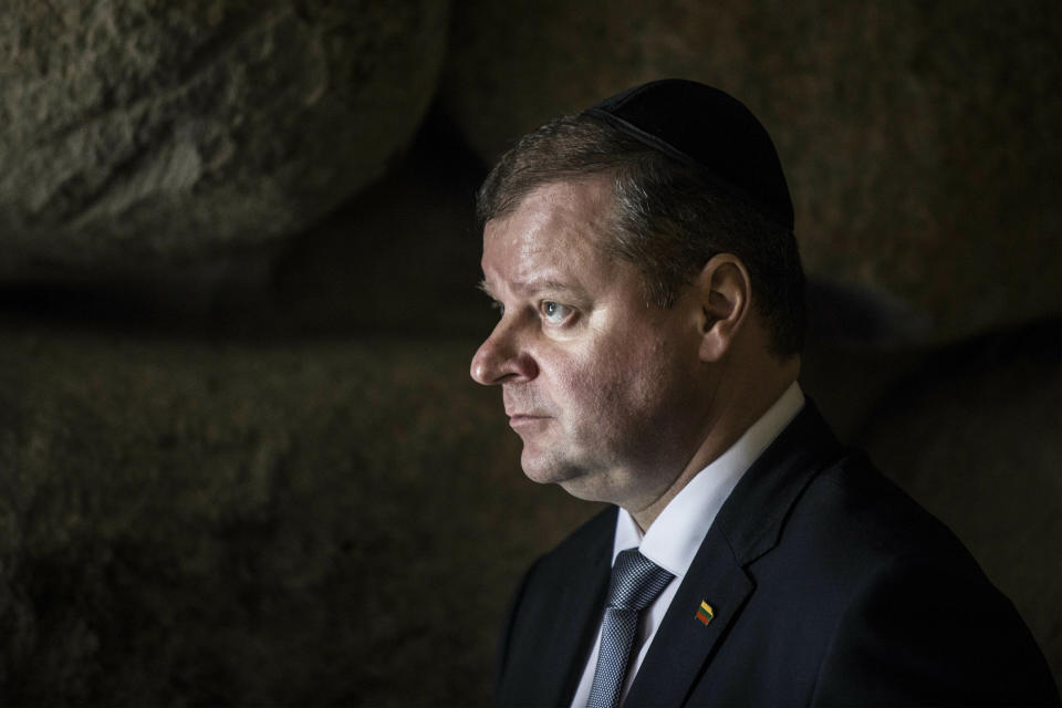 Lithuania's Prime Minister Saulius Skvernelis visits the Hall of Remembrance at the Yad Vashem Holocaust memorial, in Jerusalem, Tuesday Jan. 29, 2019. (AP Photo/Tsafrir Abayov)