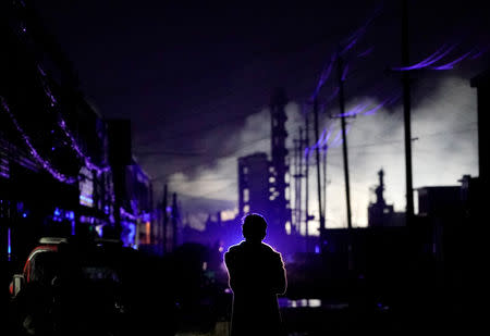 A villager stands outside his damaged house following an explosion at a pesticide plant owned by Tianjiayi Chemical, in Xiangshui county, Yancheng, Jiangsu province, China March 22, 2019. REUTERS/Aly Song