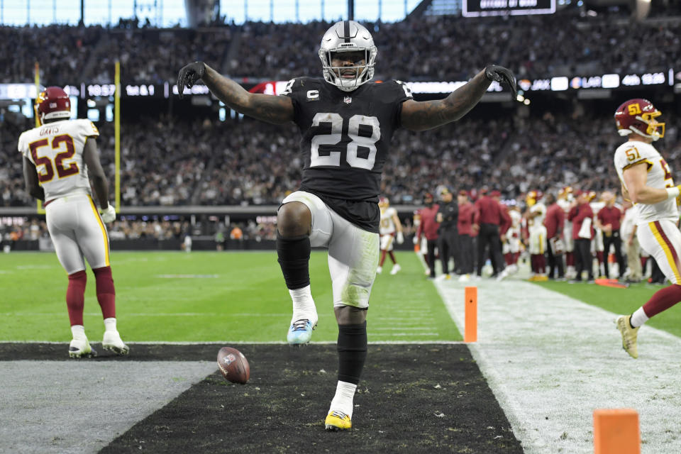 Las Vegas Raiders running back Josh Jacobs (28) celebrates after scoring a touchdown against the Washington Football Team during the second half of an NFL football game, Sunday, Dec. 5, 2021, in Las Vegas. (AP Photo/David Becker)