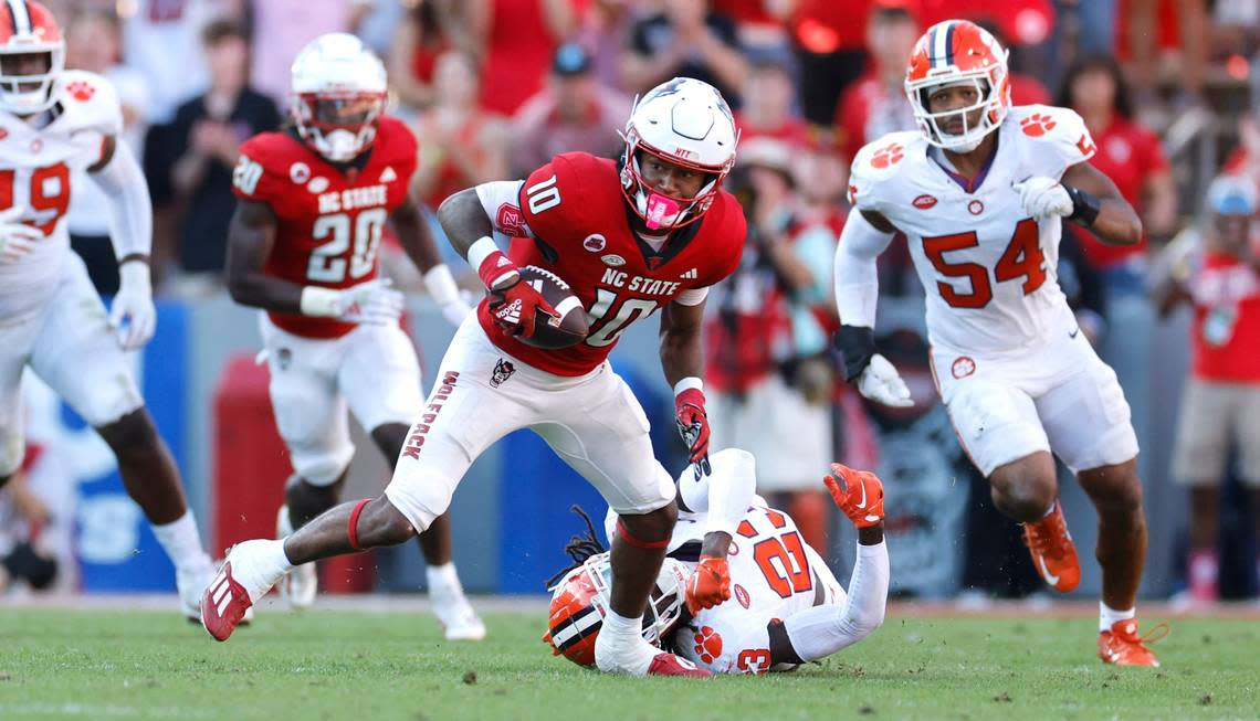 N.C. State wide receiver KC Concepcion (10) breaks free from Clemson cornerback Toriano Pride Jr. (23) on his way to score on a 72-yard touchdown reception during the second half of N.C. State’s 24-17 victory over Clemson at Carter-Finley Stadium in Raleigh, N.C., Saturday, Oct. 28, 2023. Ethan Hyman/ehyman@newsobserver.com