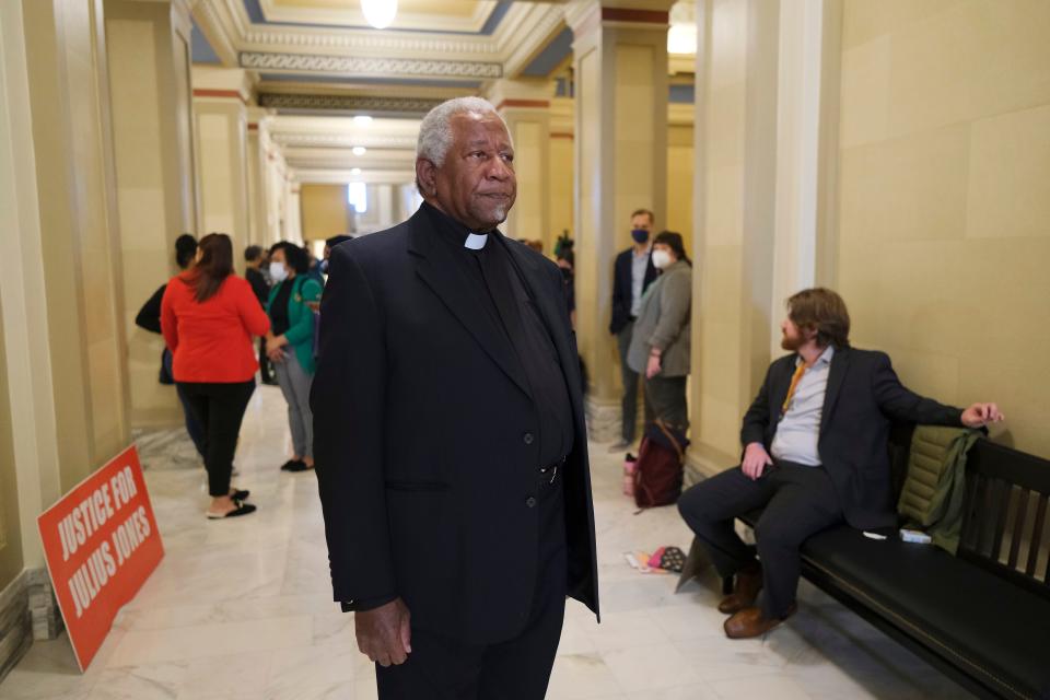 The Rev. Marvin L. Morgan of Charlottesville, Virginia, waits in the hall outside the governor's office on Tuesday at the state Capitol.