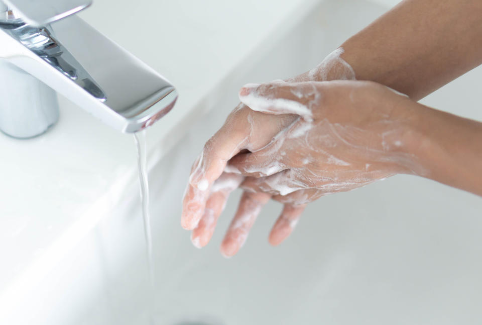 Picture of a woman washing her hands with soap, in a basin. Hand washing is effective at killing germs and can help protect you from contracting the coronavirus