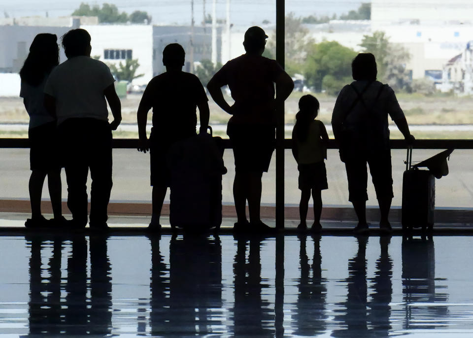 Holiday travelers pass through Salt Lake City International Airport Wednesday, July 3, 2024, in Salt Lake City. (AP Photo/Rick Bowmer)