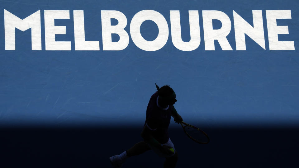 Rafael Nadal of Spain walks to the back of the court during his first round match against Marcos Giron of the U.S. at the Australian Open tennis championships in Melbourne, Australia, Monday, Jan. 17, 2022. (AP Photo/Simon Baker)