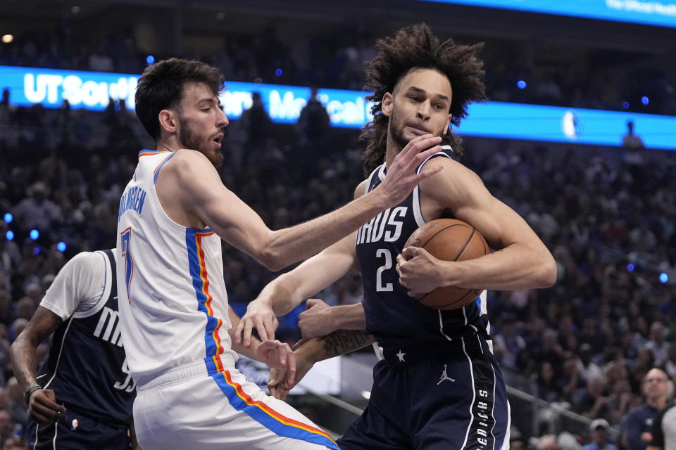 Dallas Mavericks center Dereck Lively II (2) grabs a rebound in front of Oklahoma City Thunder forward Chet Holmgren (7) during the first half in Game 3 of an NBA basketball second-round playoff series, Saturday, May 11, 2024, in Dallas. (AP Photo/Tony Gutierrez)