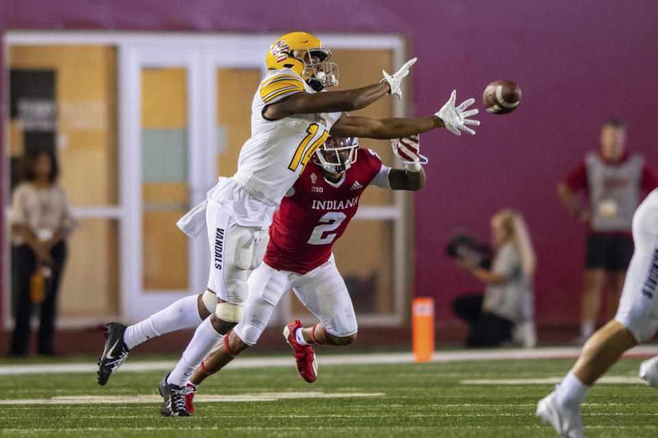 Idaho wide receiver Kyrin Beachem (14) attempts to make a catch while being covered by Indiana defensive back Reese Taylor (2) during the second half of an NCAA college football game Saturday, Sept. 11, 2021, in Bloomington, Ind. (AP Photo/Doug McSchooler)