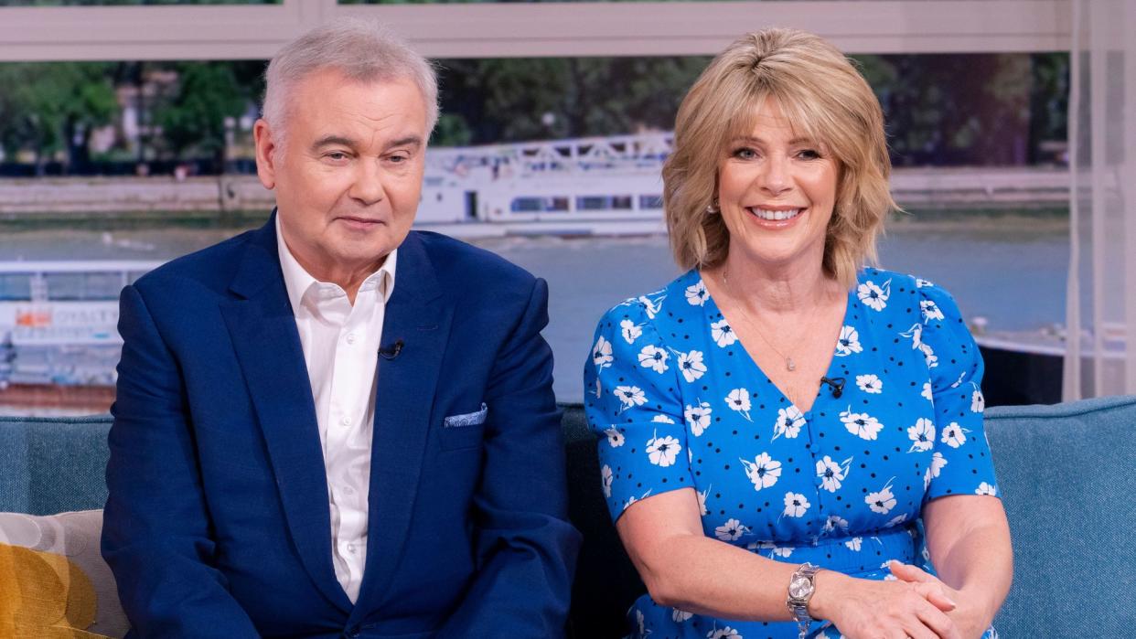 Eamonn Holmes looking glum while sat with a smiling Ruth Langsford