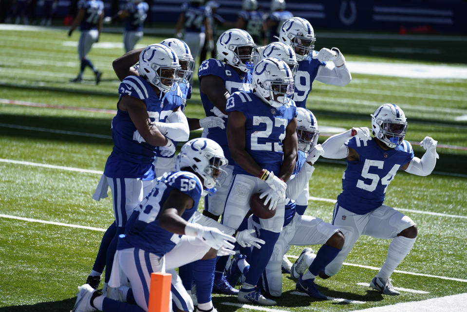 Indianapolis Colts' Kenny Moore II (23) celebrates an interception with teammates during the second half of an NFL football game against the Minnesota Vikings, Sunday, Sept. 20, 2020, in Indianapolis. (AP Photo/Michael Conroy)