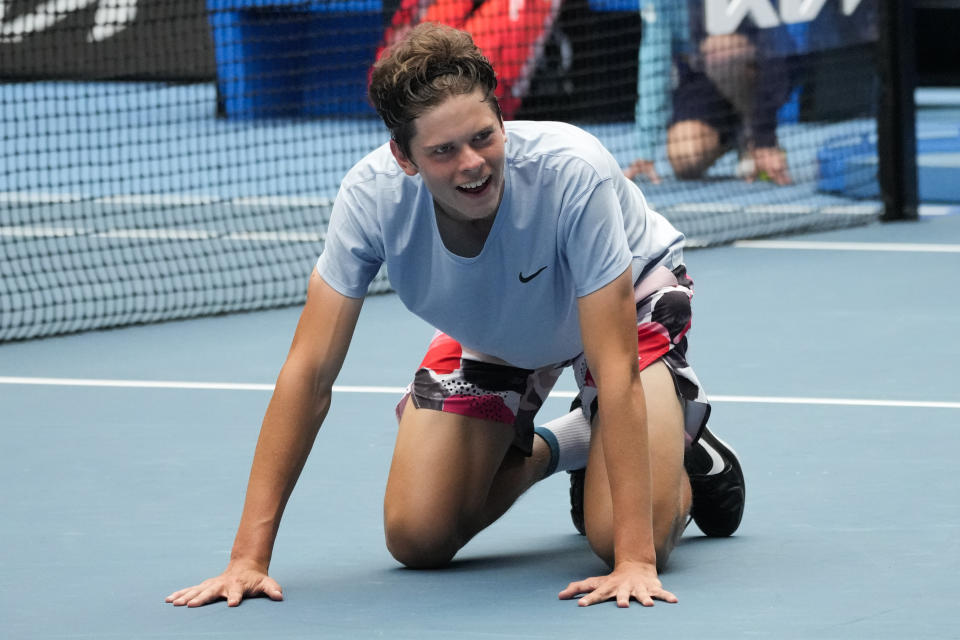 Alexander Blockx of Belgium celebrates after defeating Learner Tien of the U.S. in the boys singles final at the Australian Open tennis championship in Melbourne, Australia, Saturday, Jan. 28, 2023. (AP Photo/Dita Alangkara)