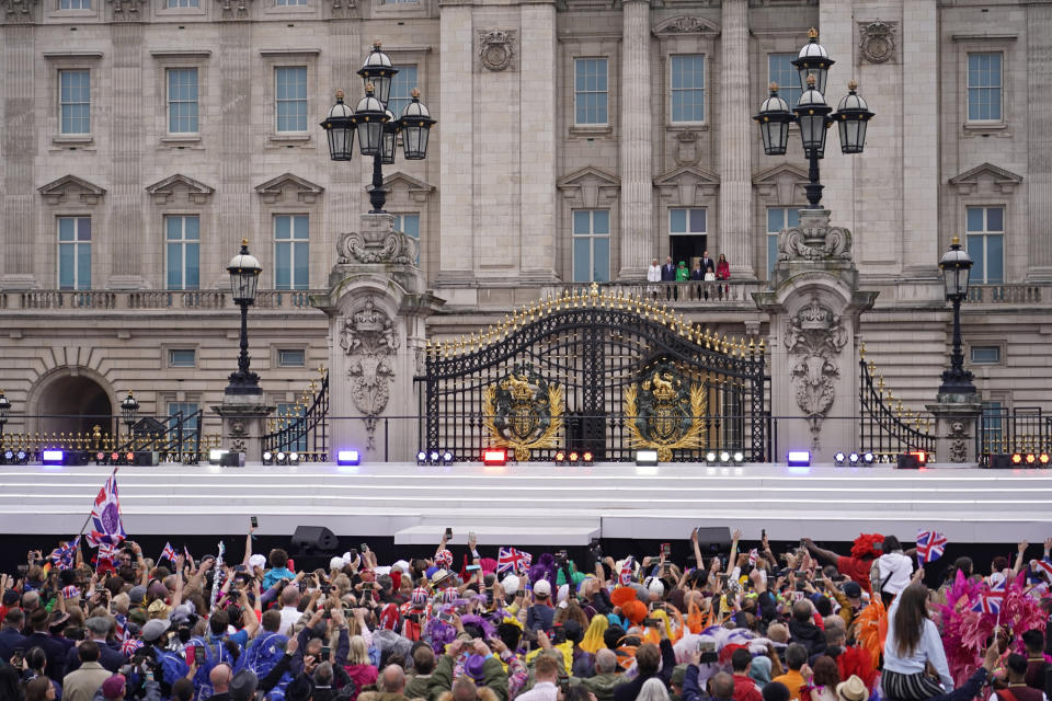 Queen Elizabeth II stand on the balcony as people gather during the Platinum Jubilee Pageant outside the Buckingham Palace in London, Sunday, June 5, 2022, on the last of four days of celebrations to mark the Platinum Jubilee. (AP Photo/Alberto Pezzali, Pool)