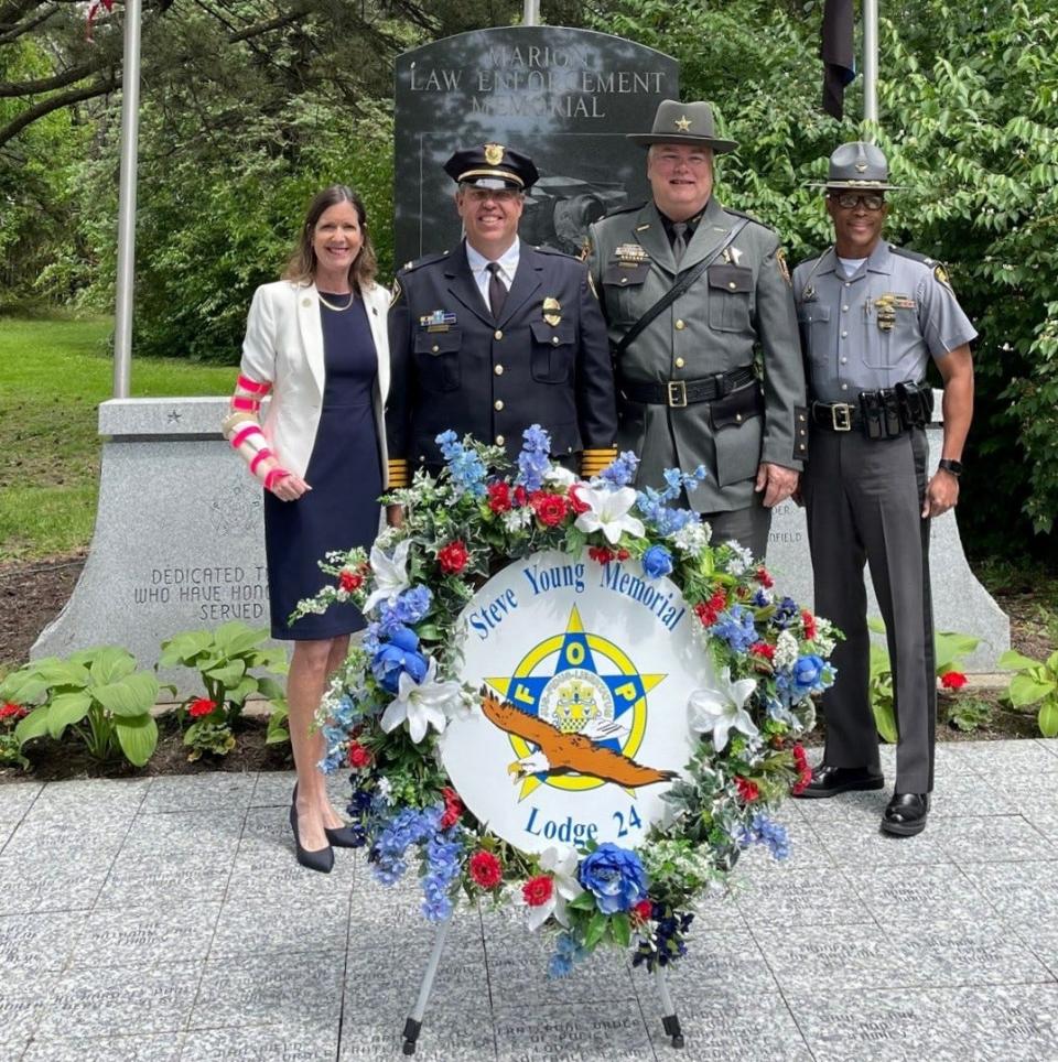 Rep. Tracy Richardson, R-Marysville, left, served as keynote speaker during the annual law enforcement memorial service held Thursday, May 25, 2023, at Marion Cemetery. Also pictured, from left to right, are Marion Police Chief Jay McDonald, Marion County Sheriff Matt Bayles, and Ohio State Highway Patrol Superintendent Col. Charles Jones.