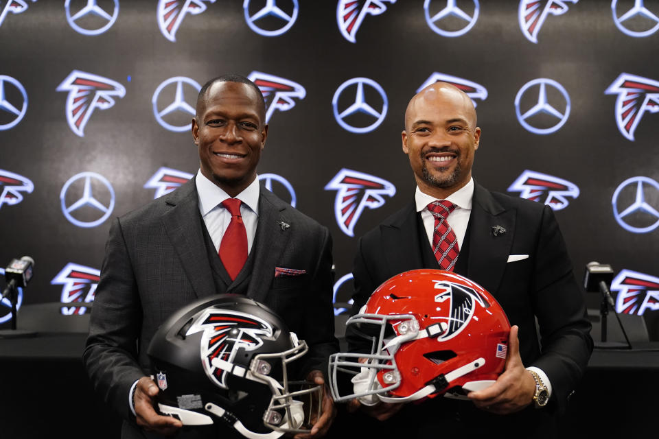 Atlanta Falcons head coach Raheem Morris, left, and general manager Terry Fontenot, right, pose after an NFL football news conference, Monday, Feb. 5, 2024, in Atlanta. (AP Photo/Brynn Anderson)