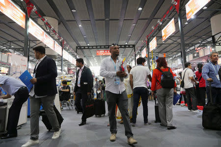 Visitors walk inside one of the exhibition halls for the China Import and Export Fair in Guangzhou, China April 17, 2017. REUTERS/Venus Wu