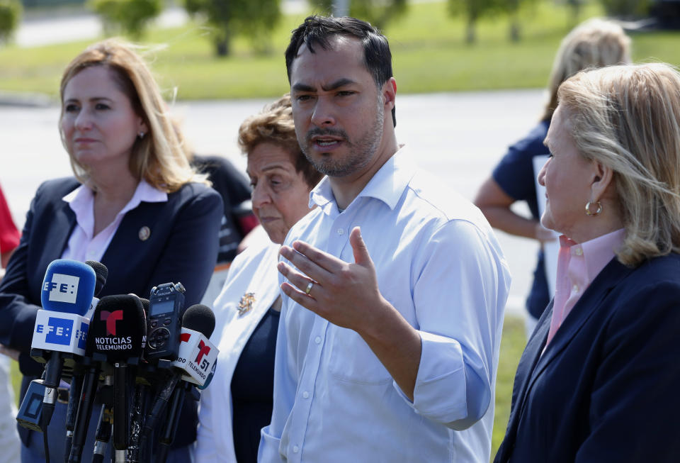 Rep. Joaquin Castro, D-Texas, second from right, chairman of the Congressional Hispanic Caucus, speaks during a news conference after touring the Homestead Temporary Shelter for Unaccompanied Children with Rep. Debbie Mucarsel-Powell, D-Fla., left, Rep. Donna Shalala, D-Fla., second from left, and Rep. Sylvia Garcia, D-Texas, right, Tuesday, Feb. 19, 2019, in Homestead, Fla. (AP Photo/Wilfredo Lee)