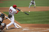 St. Louis Cardinals' Yadier Molina hits a two-run home run during the second inning in the first game of a baseball doubleheader against the Detroit Tigers Thursday, Sept. 10, 2020, in St. Louis. Molina is wearing the number 21 in honor of Roberto Clemente. (AP Photo/Scott Kane)