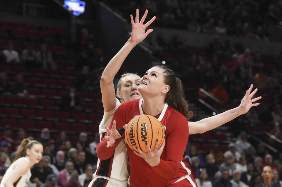 North Carolina State center River Baldwin, front, looks to shoot as Stanford forward Cameron Brink defends during the first half of a Sweet 16 college basketball game in the women's NCAA Tournament against Stanford, Friday, March 29, 2024, in Portland, Ore. (AP Photo/Steve Dykes)