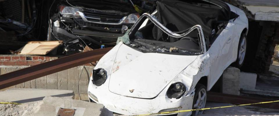 FAR ROCKAWAY, NEW YORK - NOVEMBER 4, 2012: Destroyed luxury car in the aftermath of Hurricane Sandy in Far Rockaway, New York. Image taken 5 days after Superstorm Sandy hit New York