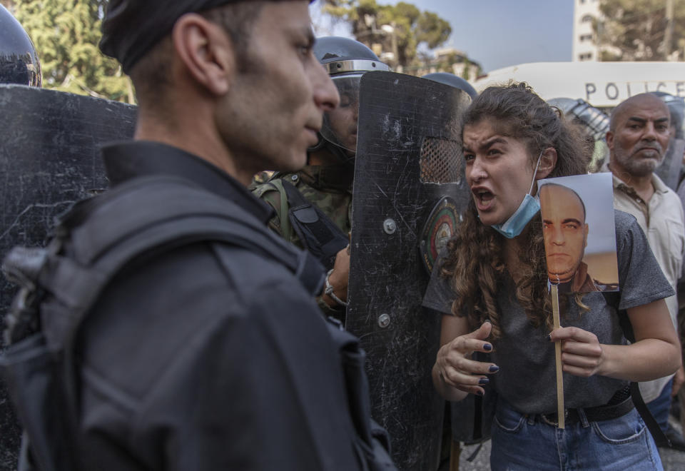 CORRECTS DATE TO THURSDAY JUNE 24, 2021 -- Riot police block angry demonstrators before dispersing them during a rally protesting the death of Nizar Banat, an outspoken critic of the Palestinian Authority, in the West Bank city of Ramallah, Thursday June 24, 2021. Banat was a candidate in parliamentary elections called off earlier this year died after Palestinian security forces arrested him and beat him with an iron rod on Thursday, his family said. (AP Photo/Nasser Nasser)