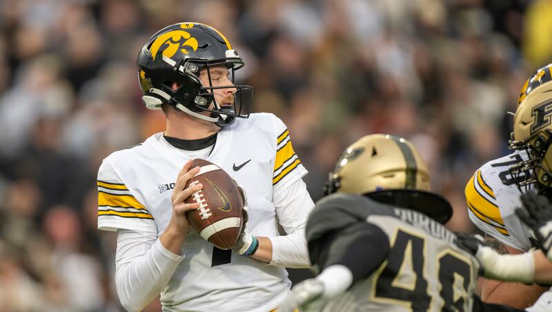 Iowa quarterback Spencer Petras (7) prepares to throw the ball during the first quarter of an NCAA college football game against Purdue, Saturday, Nov. 5, 2022, in West Lafayette, Ind.