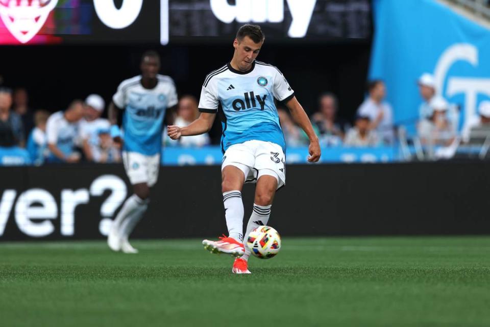 Charlotte FC midfielder Andrew Privett (34) passes the ball against D.C. United during Saturday’s first half at Bank of America Stadium. Cory Knowlton-USA TODAY Sports